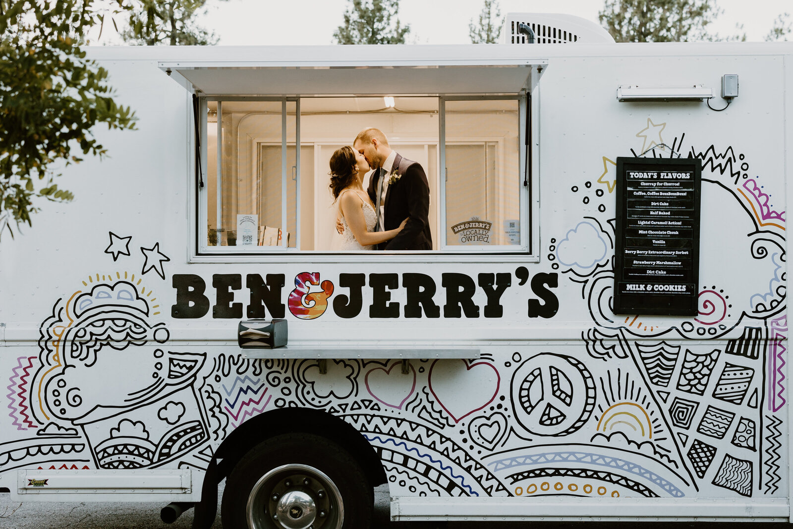 married couple kissing in ben & jerrys truck
