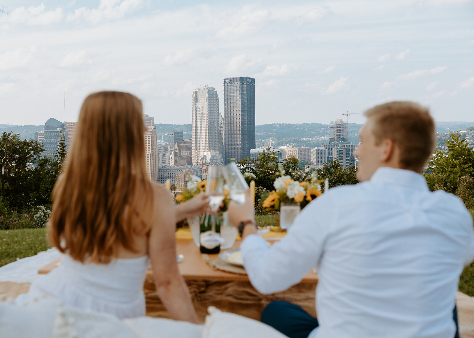 A proposal on Mount Washington in featuring a couple with the city in the background captured by Pittsburgh wedding photographer