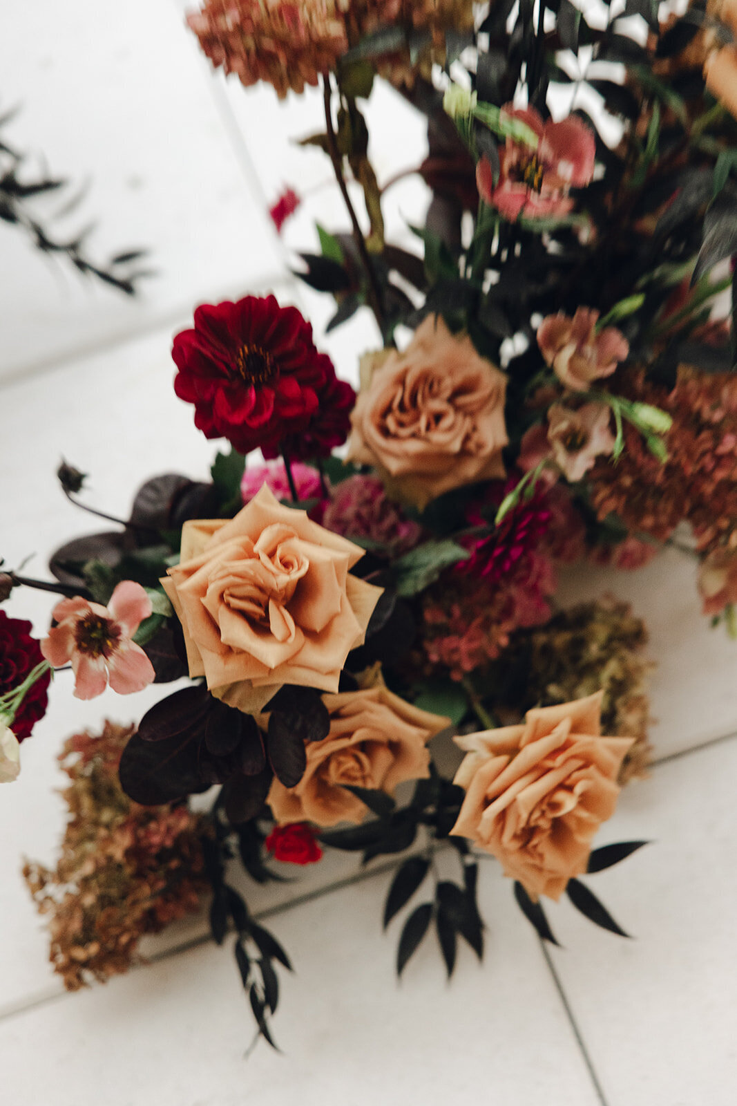 High-impact centerpieces designed with bright color blocking and sculptural floral shapes for a Dallas wedding reception.