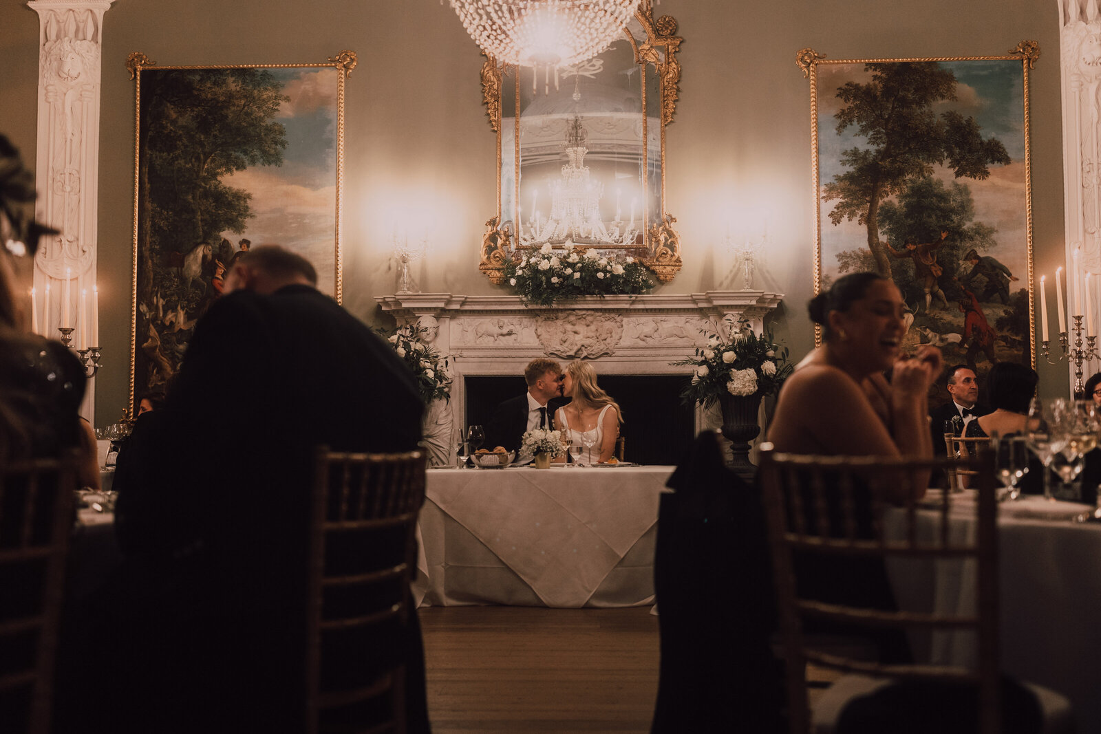 couple kissing at their wedding reception