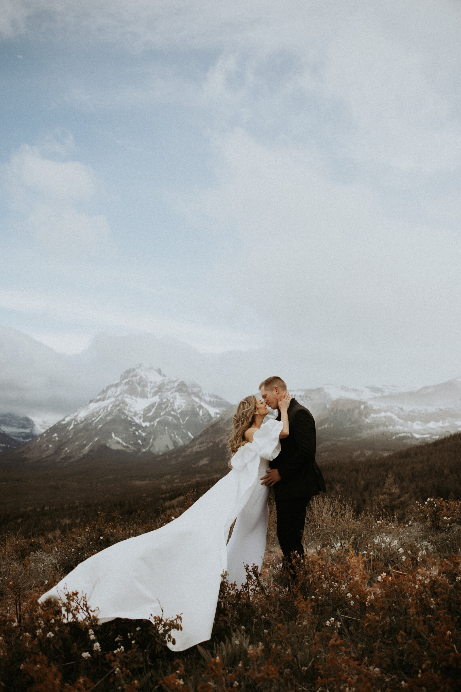 bride and groom kissing each other during elopement photos in montana
