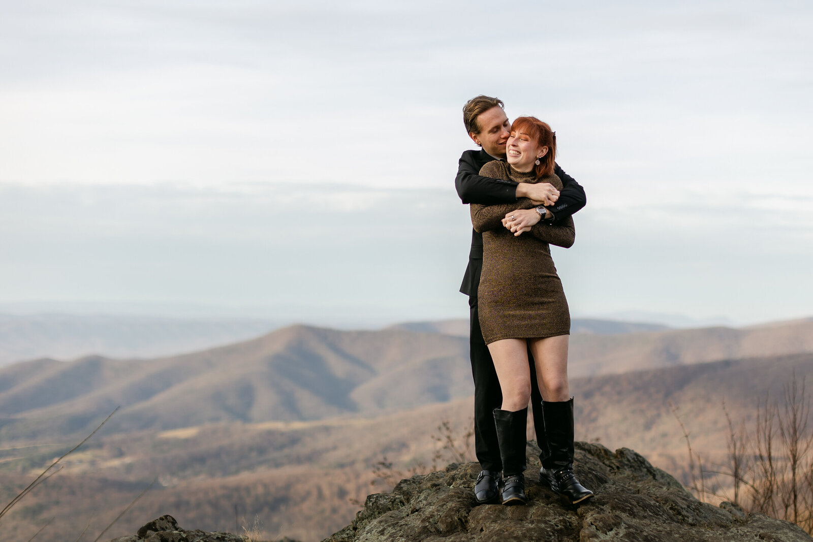 Engaged couple on mountain top