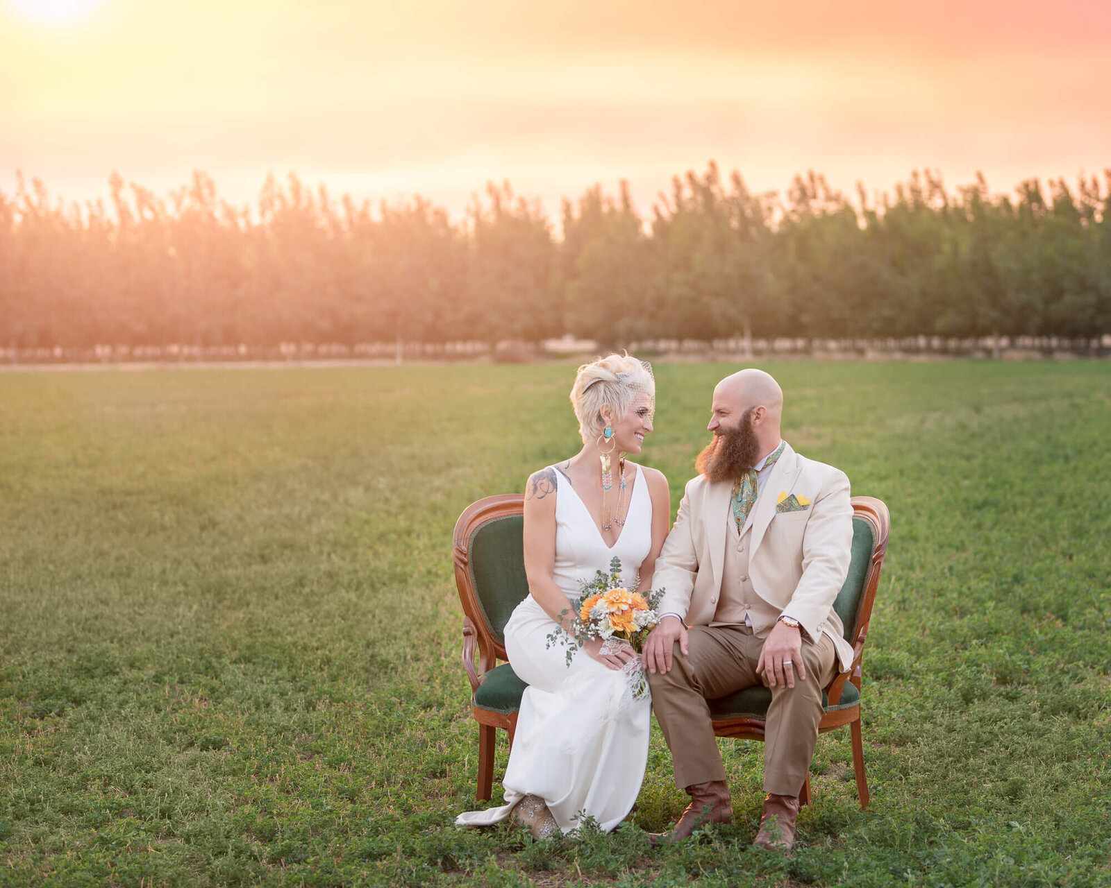 Bride and groom portrait in  a farm field
