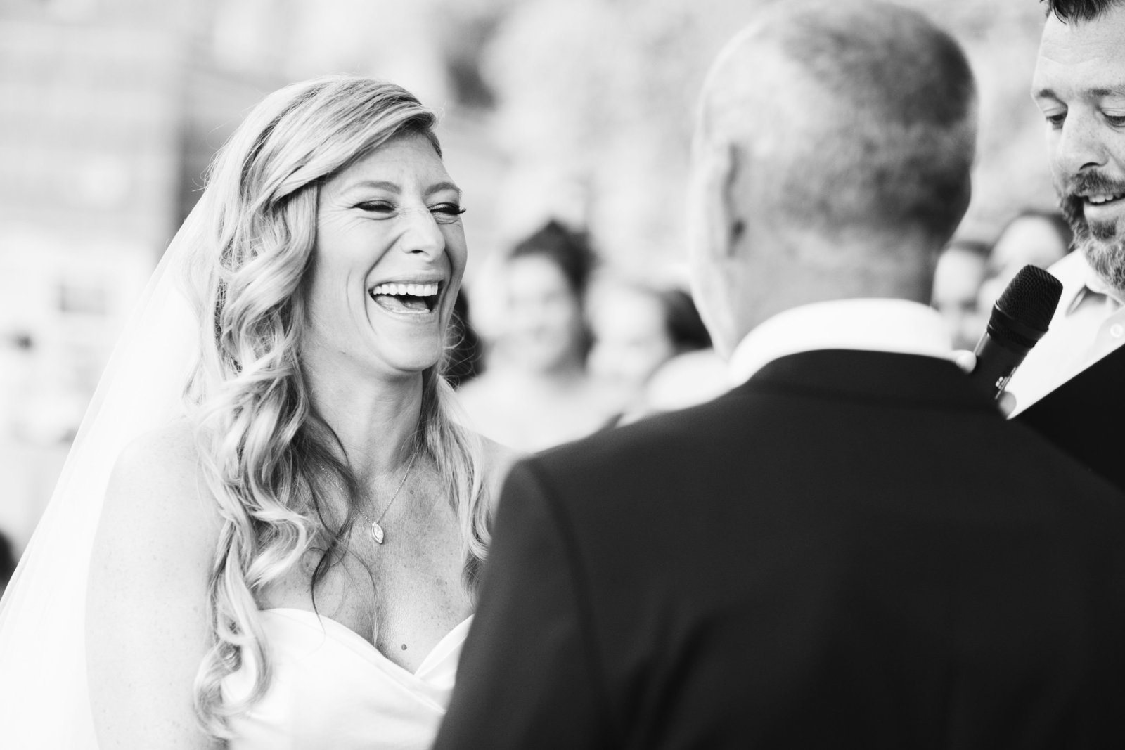 bride laughing during the ceremony at George Weir Barn
