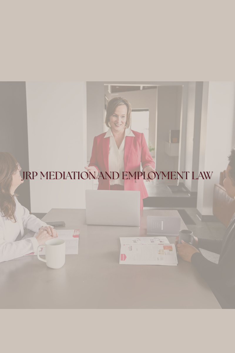 alt="Jennifer R Petersen in a red blazer greeting clients in a professional office setting, JRP Mediation and Employment Law Firm"
