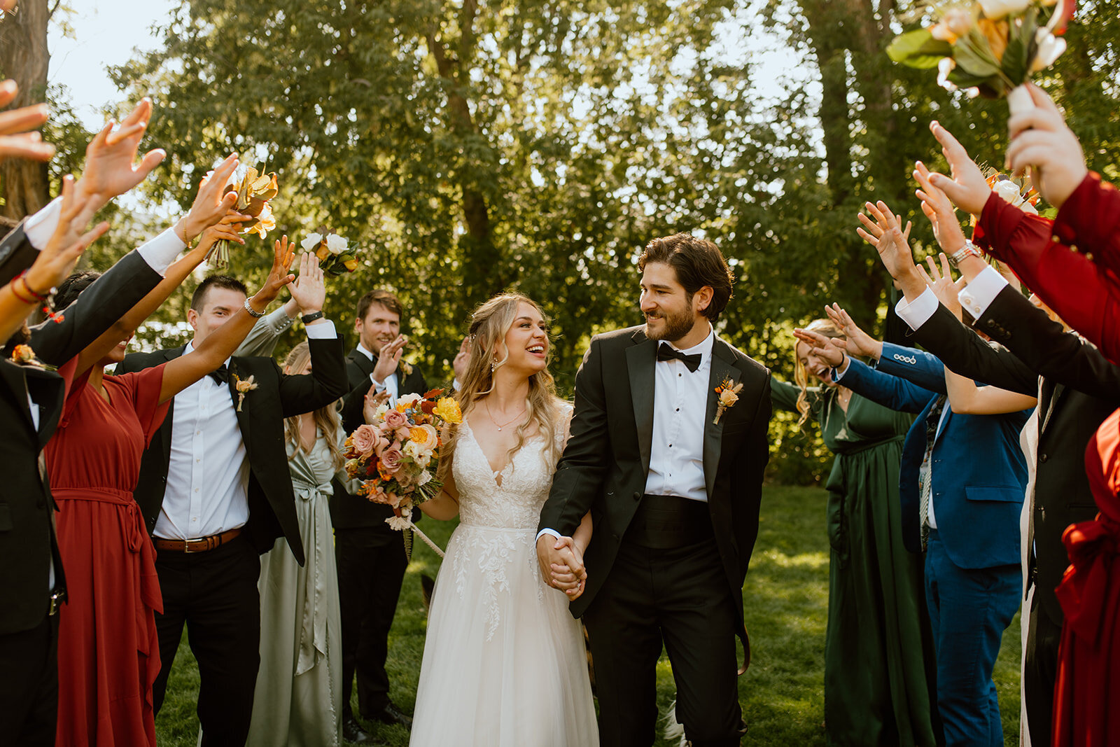bride and groom wedding party tunnel