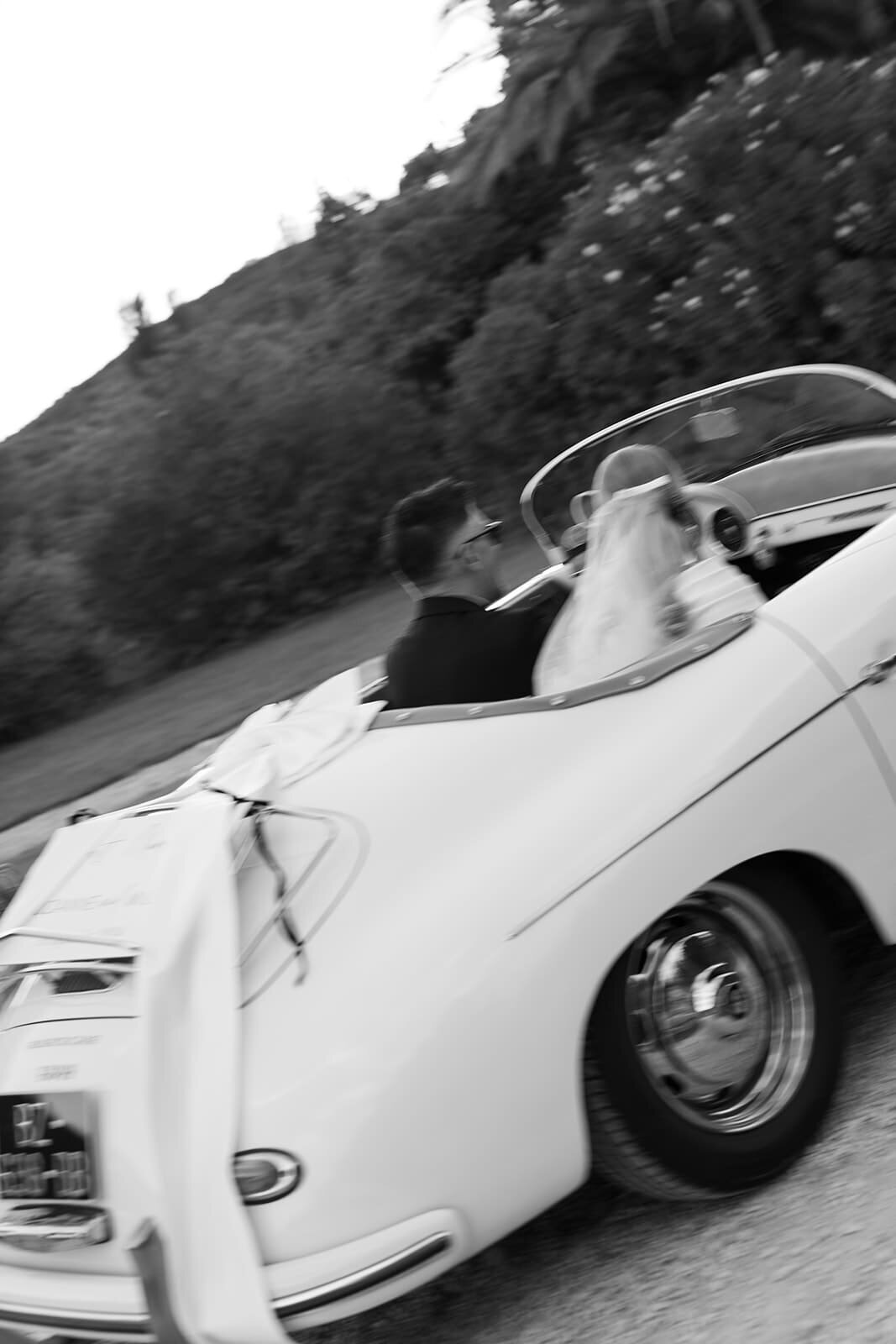 Wedded-couple-in-classic-car-French-chateau-wedding