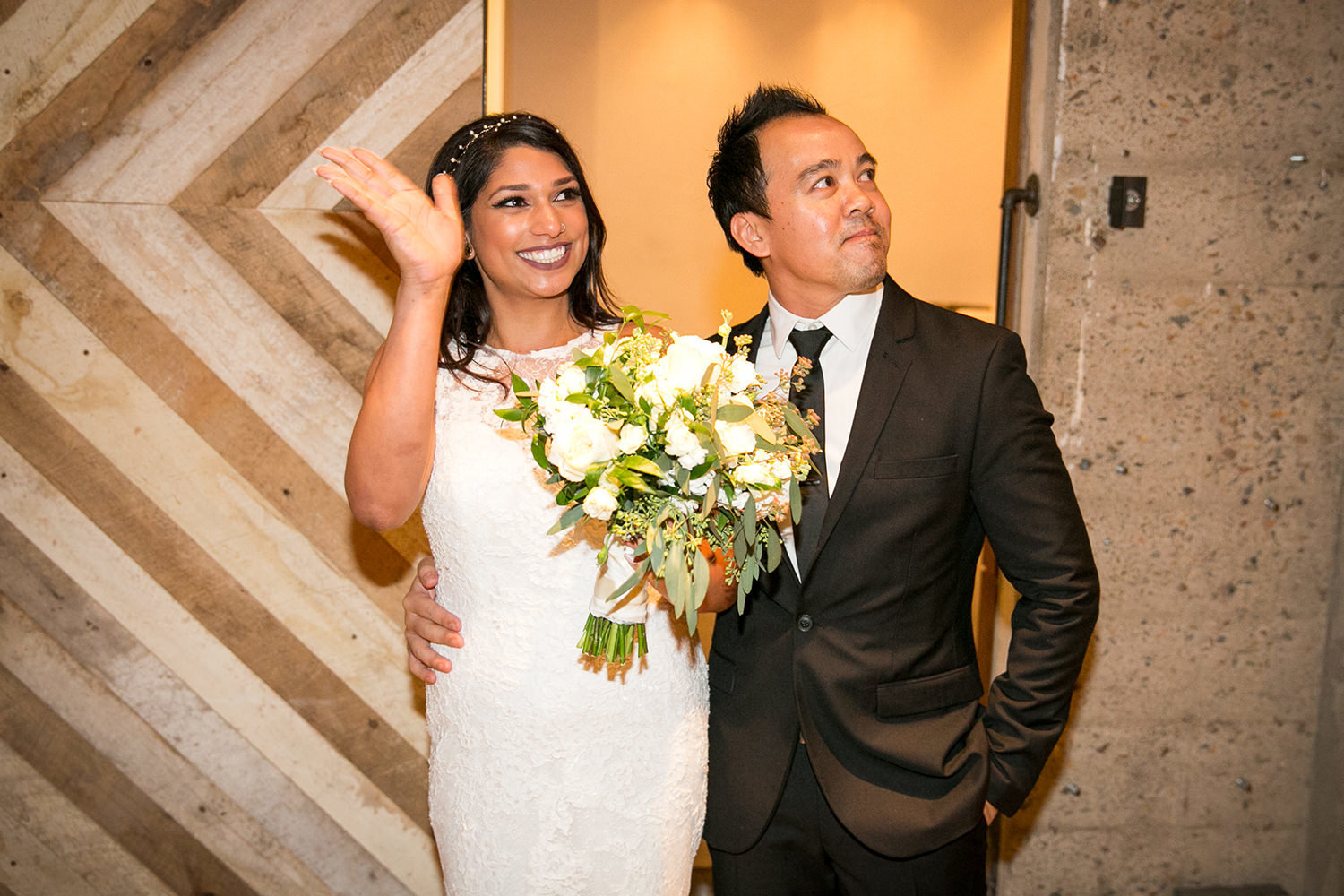 couple walking into their reception at luce loft