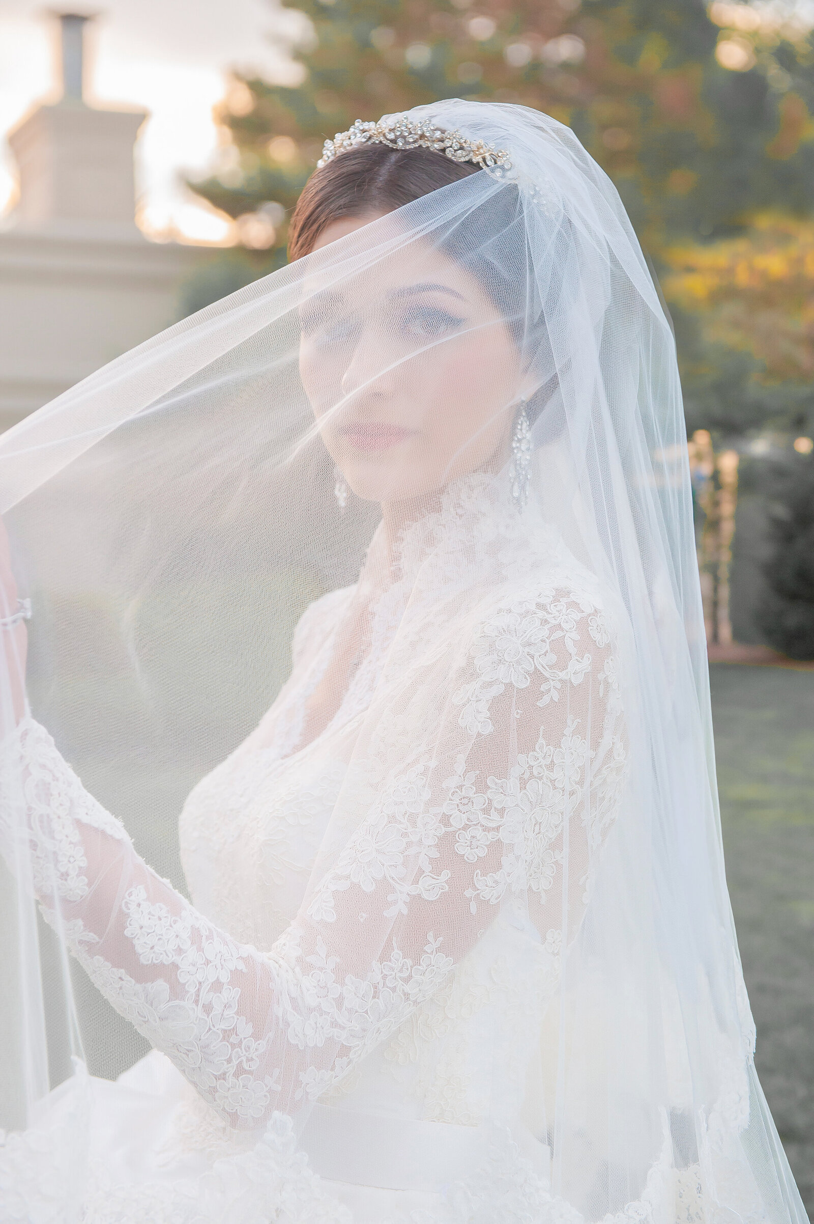 Bride looking out from under veil