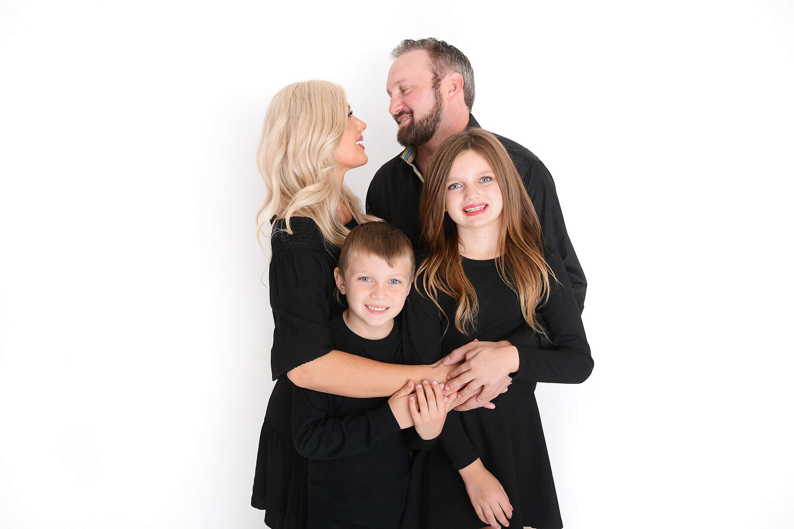 family poses together  at their photoshooot