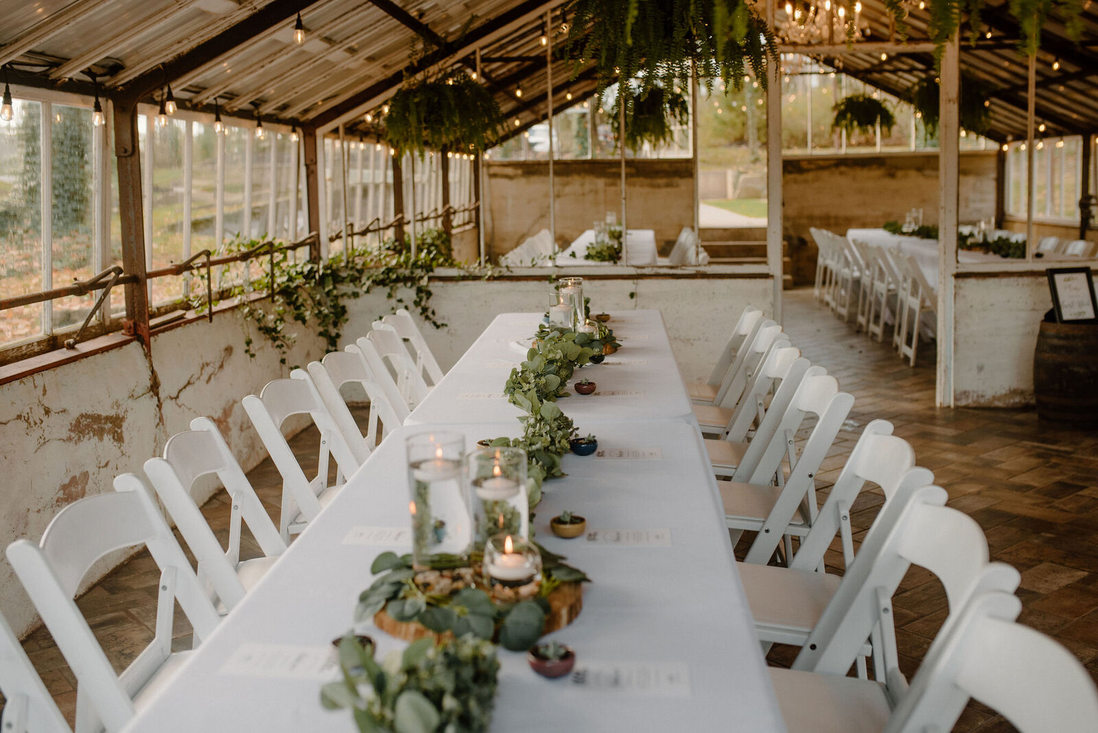 eucalyptus table centerpiece in greenhouse at Historic Shady Lane wedding