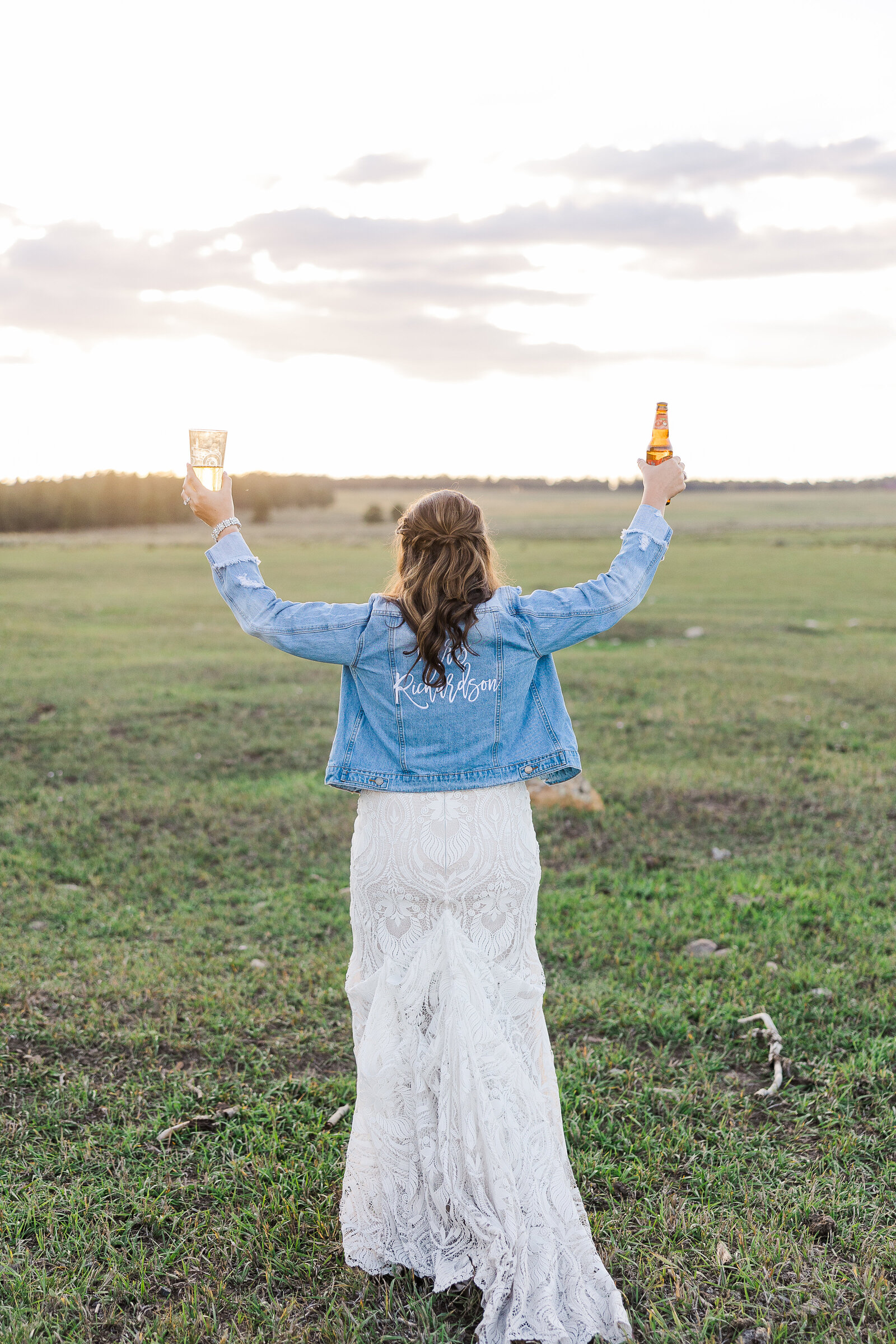 Bride holding two beers