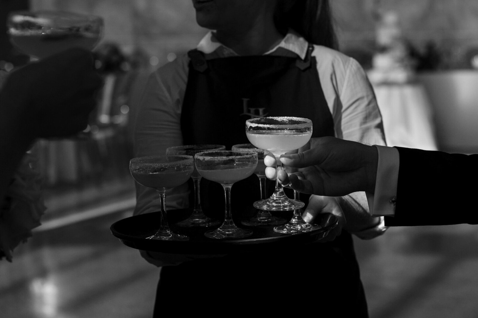 People holding glasses at a Levantine Hill wedding reception