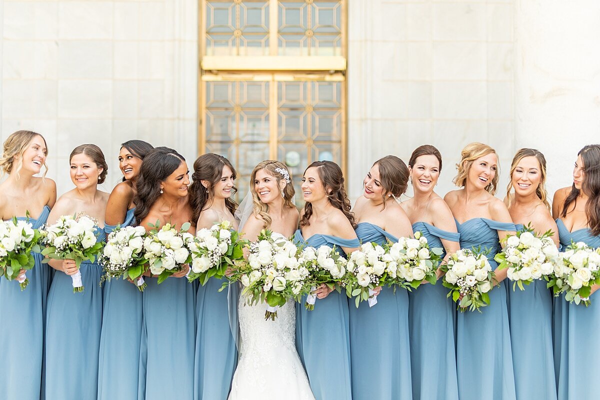 Bride and bridesmaids wearing blue dresses by Sherr Weddings based in Vista, California.