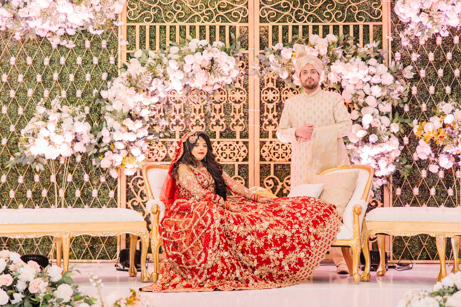 Desi-bride-and-groom-on-stage-couple-photography-poses