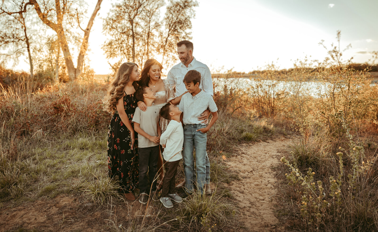 MOther and father gaze at their children in this beautiful family photography session in Dallas, TX
