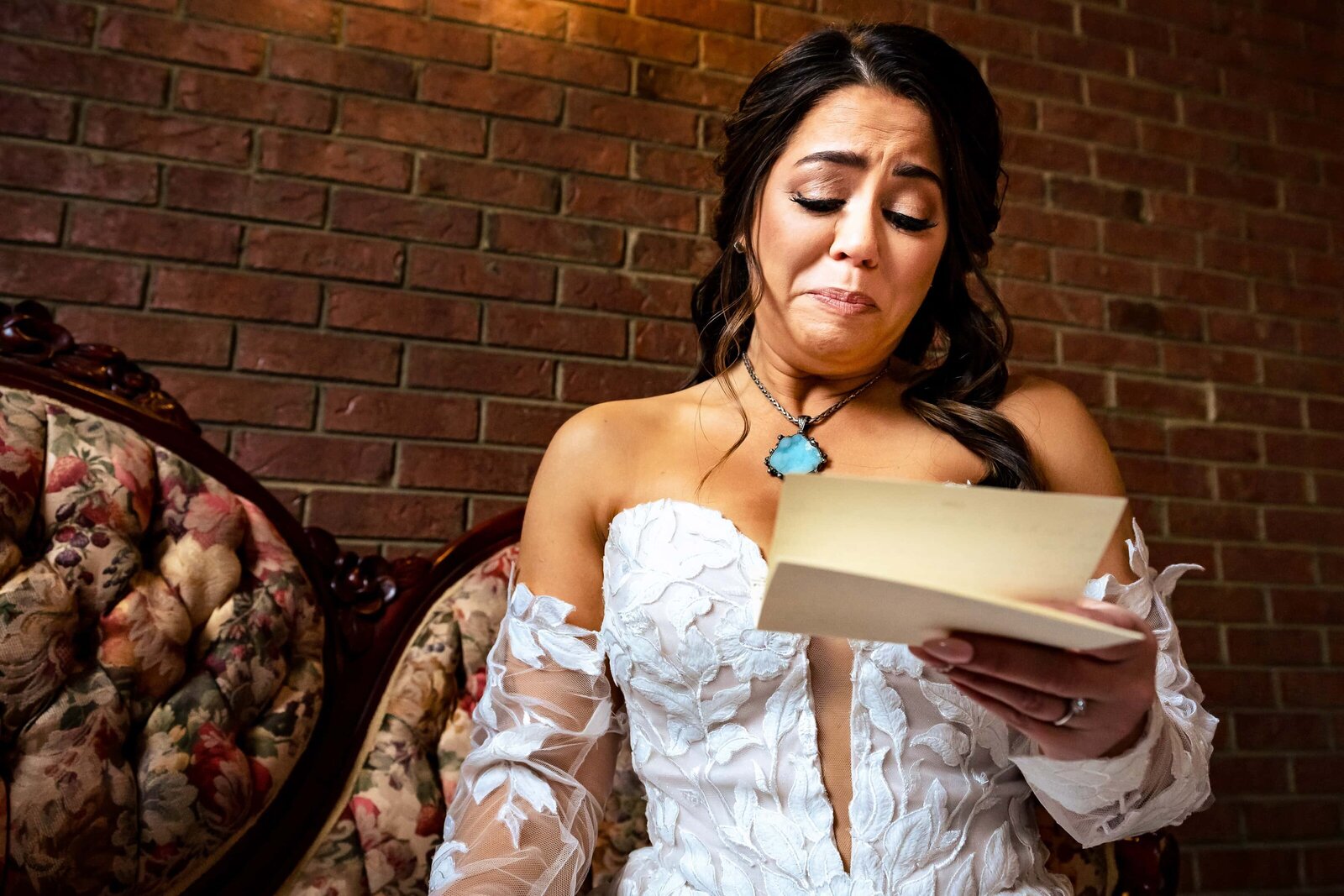 Bride cries as she reads a letter from the groom before the wedding ceremony