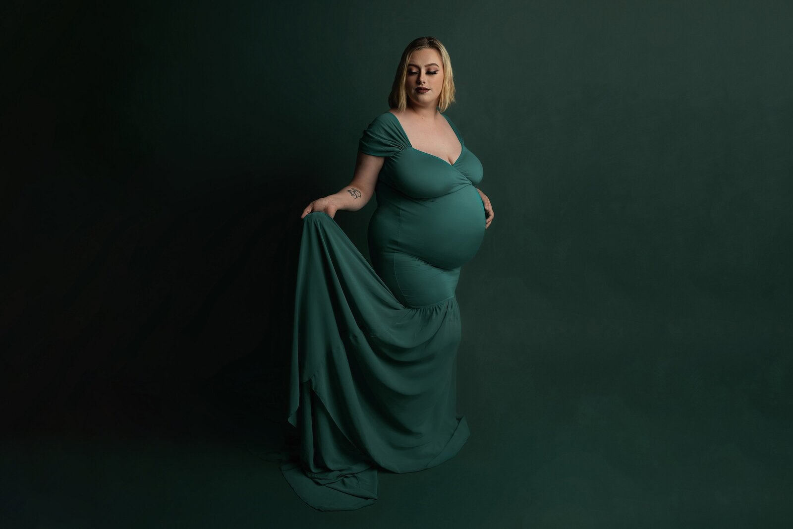 pregnant woman in beautiful gown