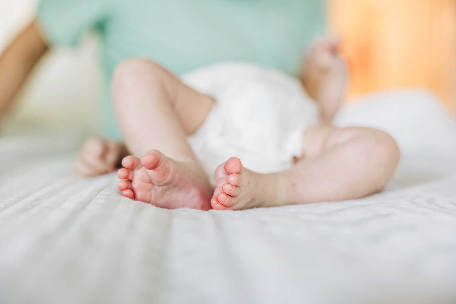 tiny feet captured in home near st pete light and bright