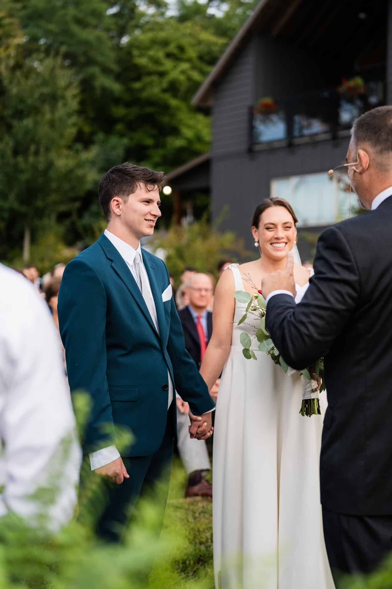 bride and groom during their wedding ceremony at terra incognita vineyard wedding venue 