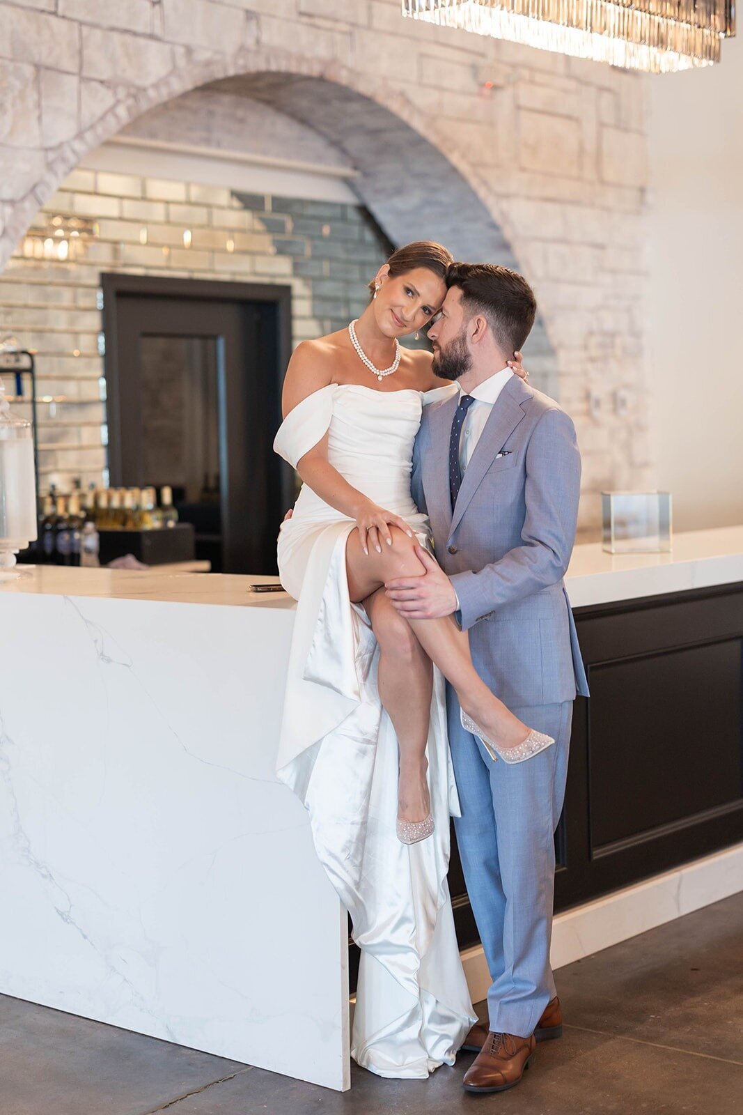bride and groom sharing affectionate moment together at the grbic events, a luxury wedding venue in st. louis
