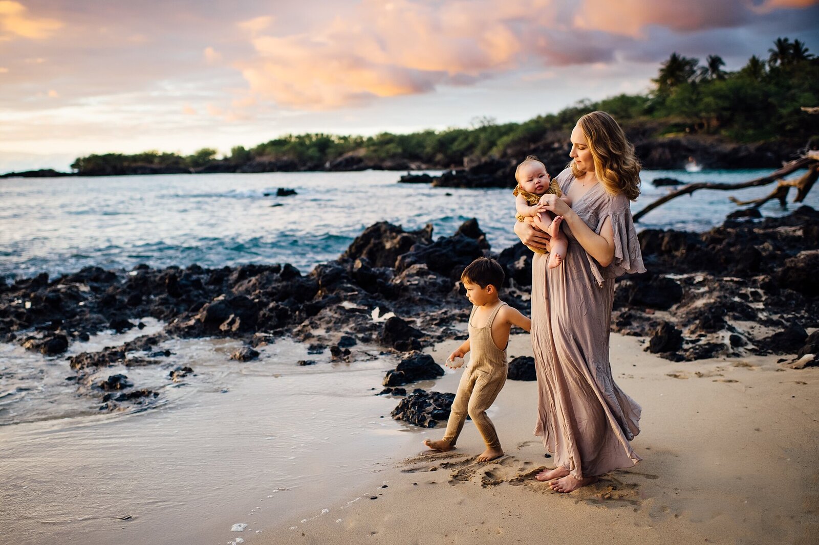 mom and her kids at puako beach in hawaii