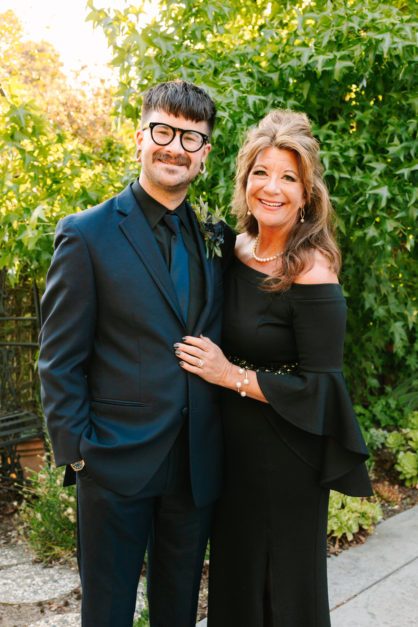 A groom with his mother before his wedding.