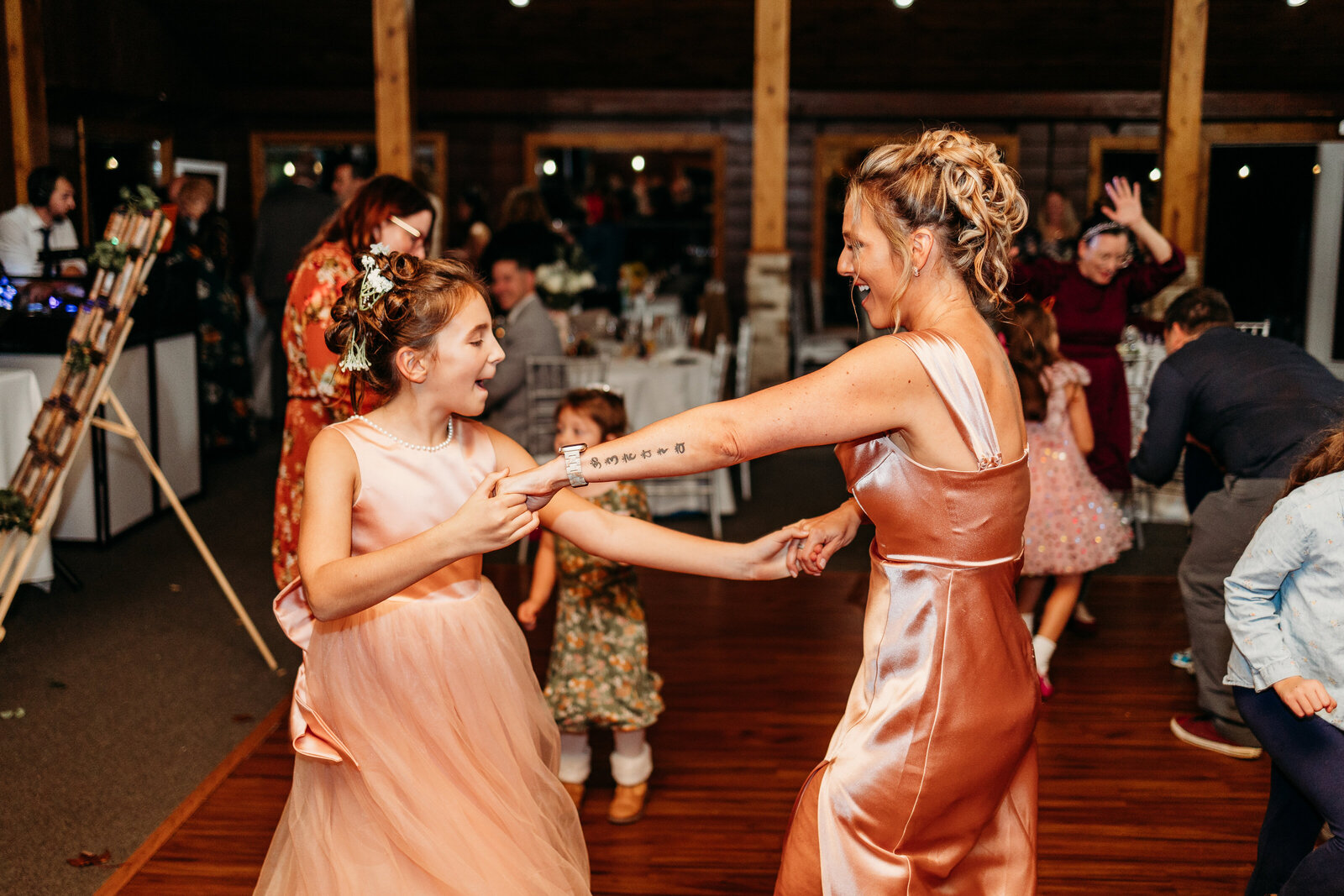 Mother and daughter dance to the music at a wedding reception
