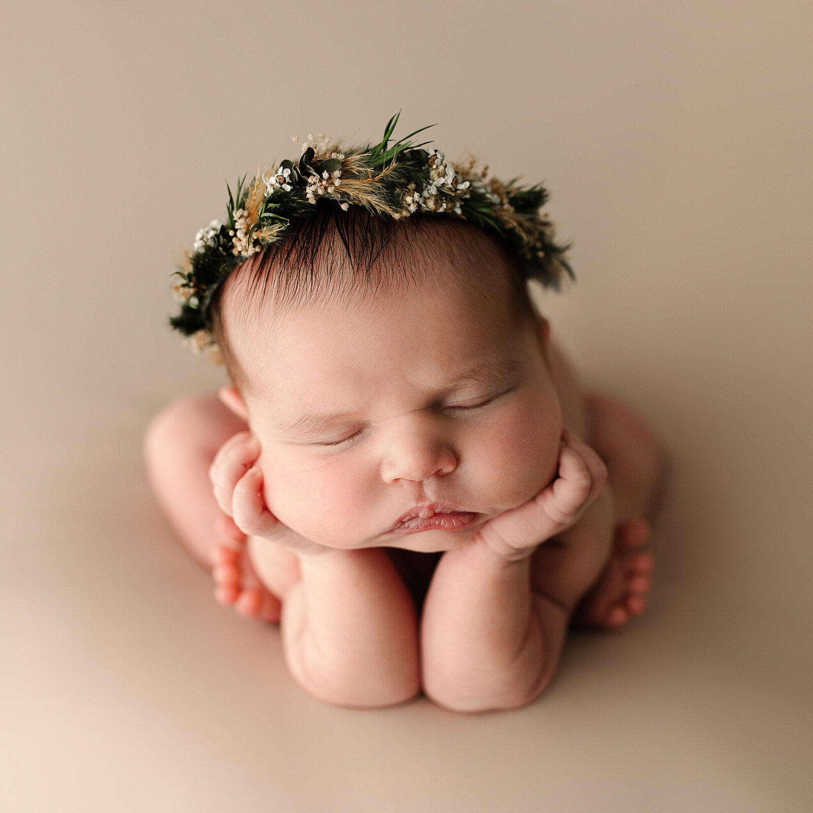 Newborn with hands under chin studio Swanton Ohio