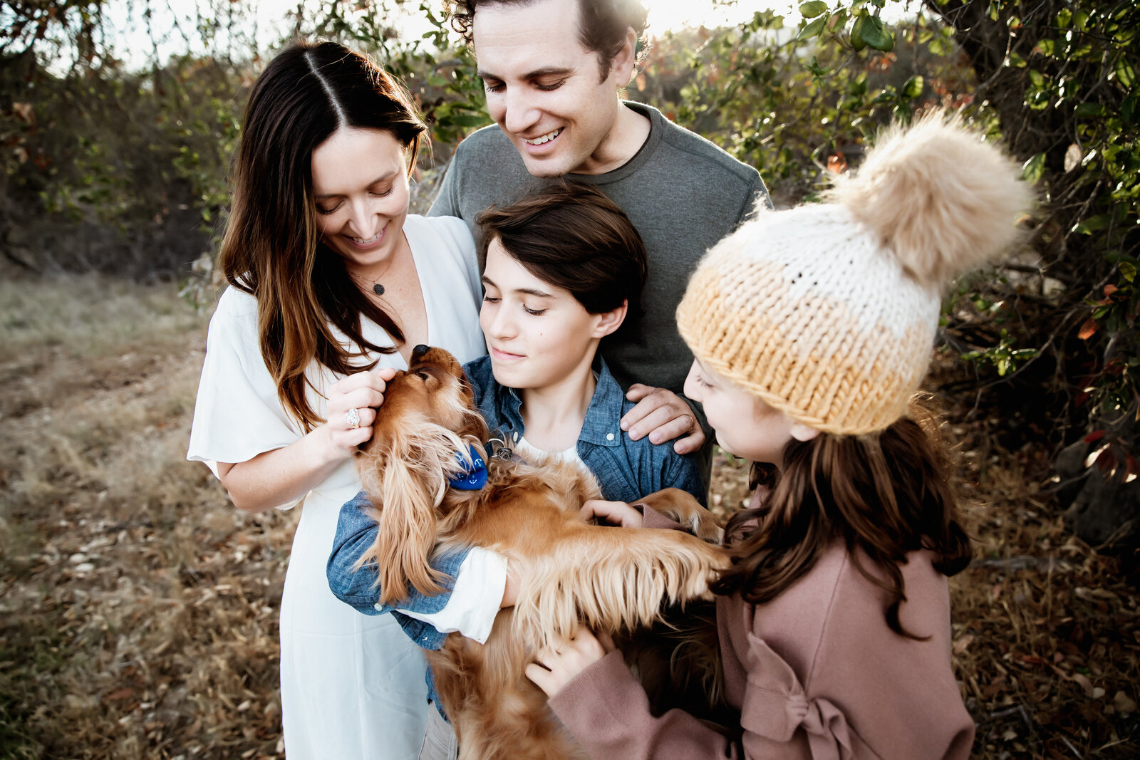 untitled-211119-164-Editfamily-snuggle-their-cute-dog-montecito-family-portraits