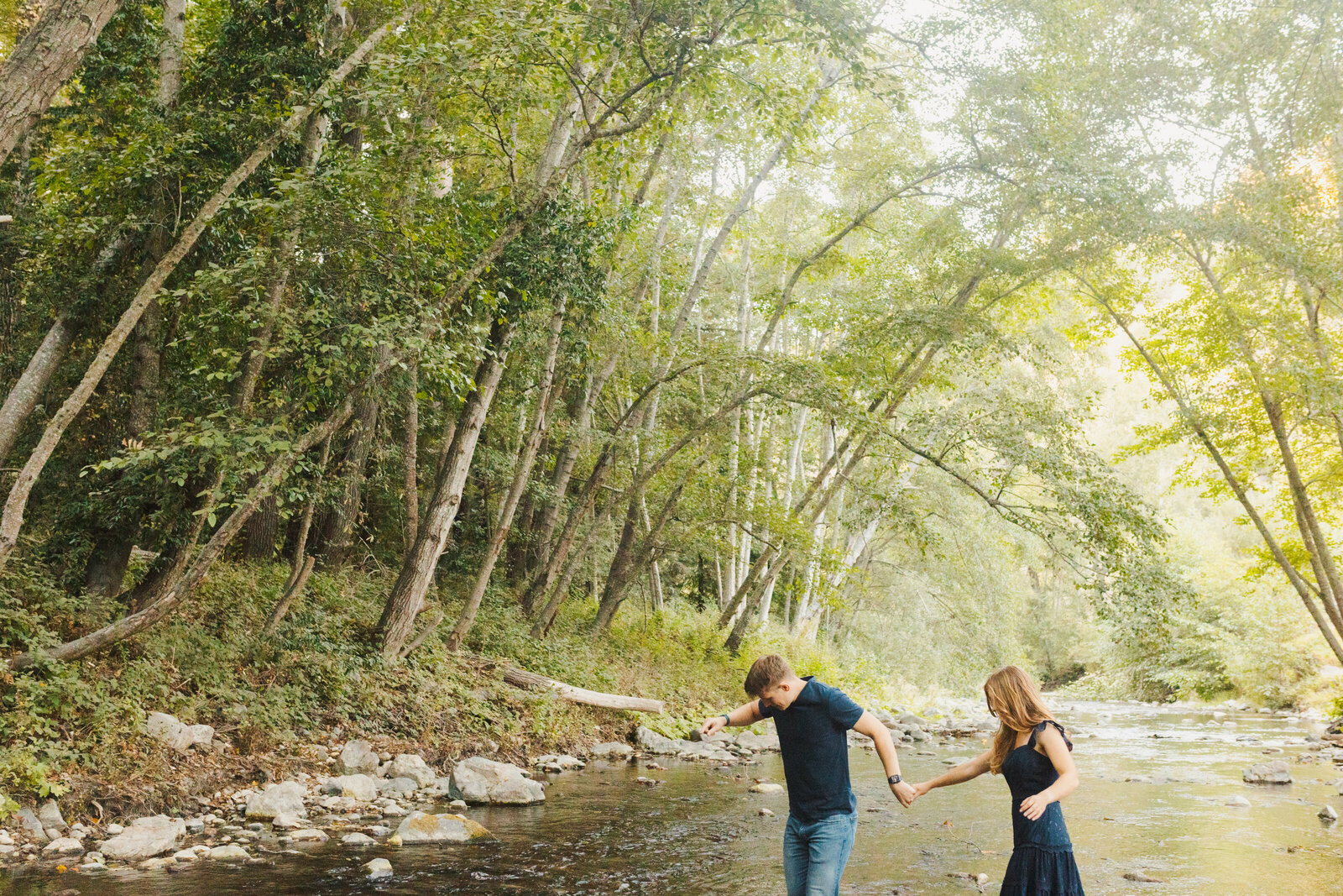 A couple poses for their engagement photos in Big Sur, California.