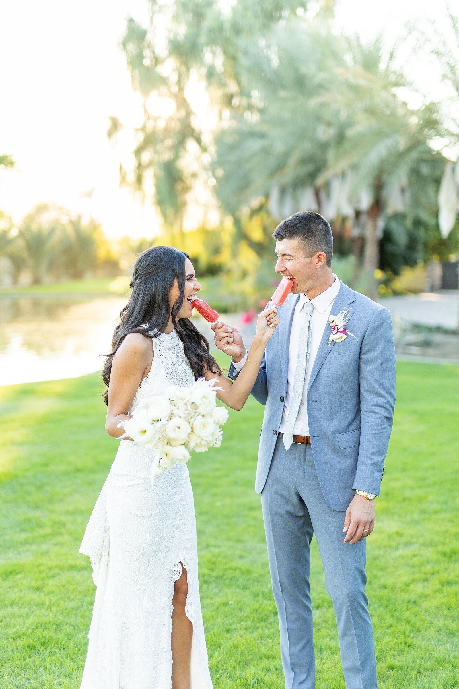 Bride and groom eating popsicles from Palm Springs Paletas at The Old Polo Estate in Coachella, California | Sherr Weddings
