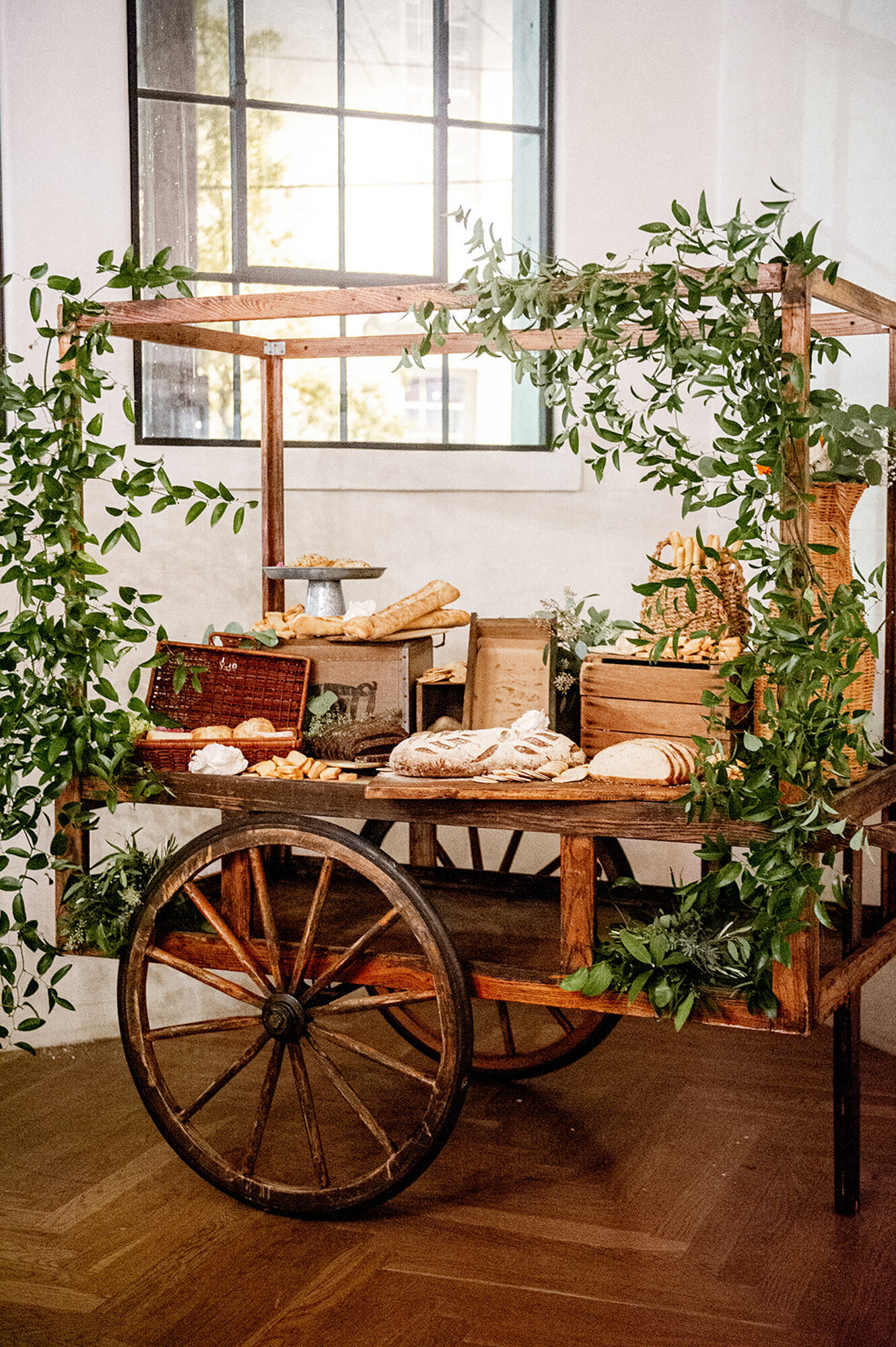 charcuterie with bread on cart design at reception