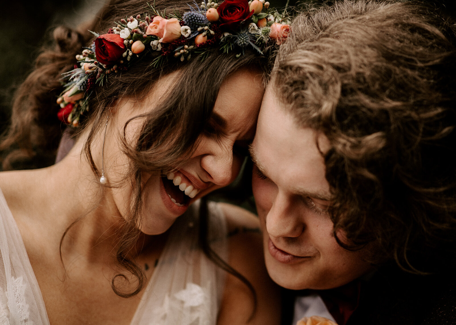 Bride laughing with groom 