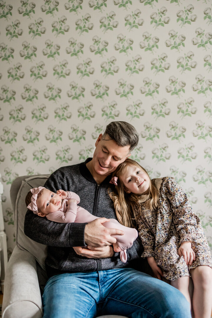 Father holding baby girl