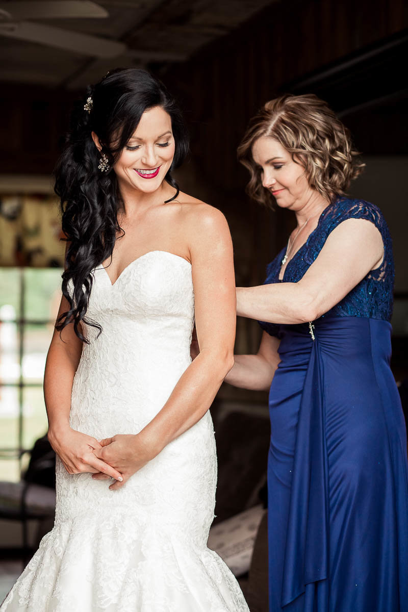 Bride gets into dress, Boals Farm, Charleston, South Carolina