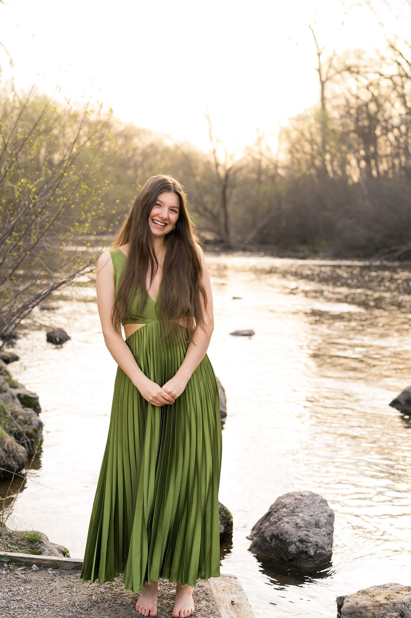wearing beautiful green dress standing in front of a beautiful creek in Kensington Metropark.