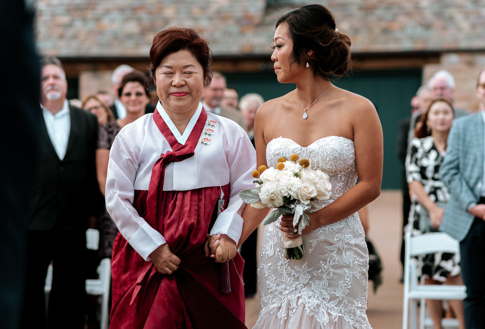 Mom of bride in traditional korean garb for the wedding at Cherokee Ranch in Colorado.