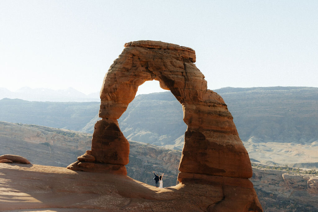 Bride and groom exploring Utah’s wilderness during their adventure elopement