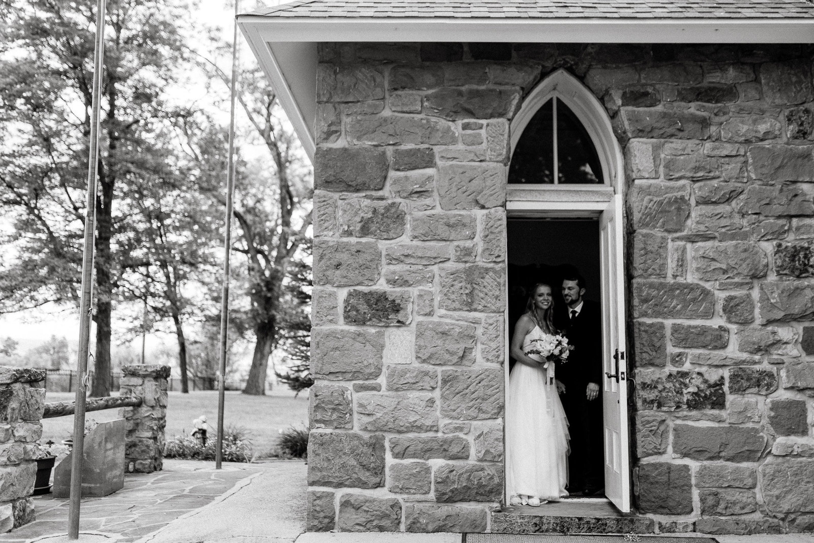 Stone cathedral newlyweds professional photo in black and white.