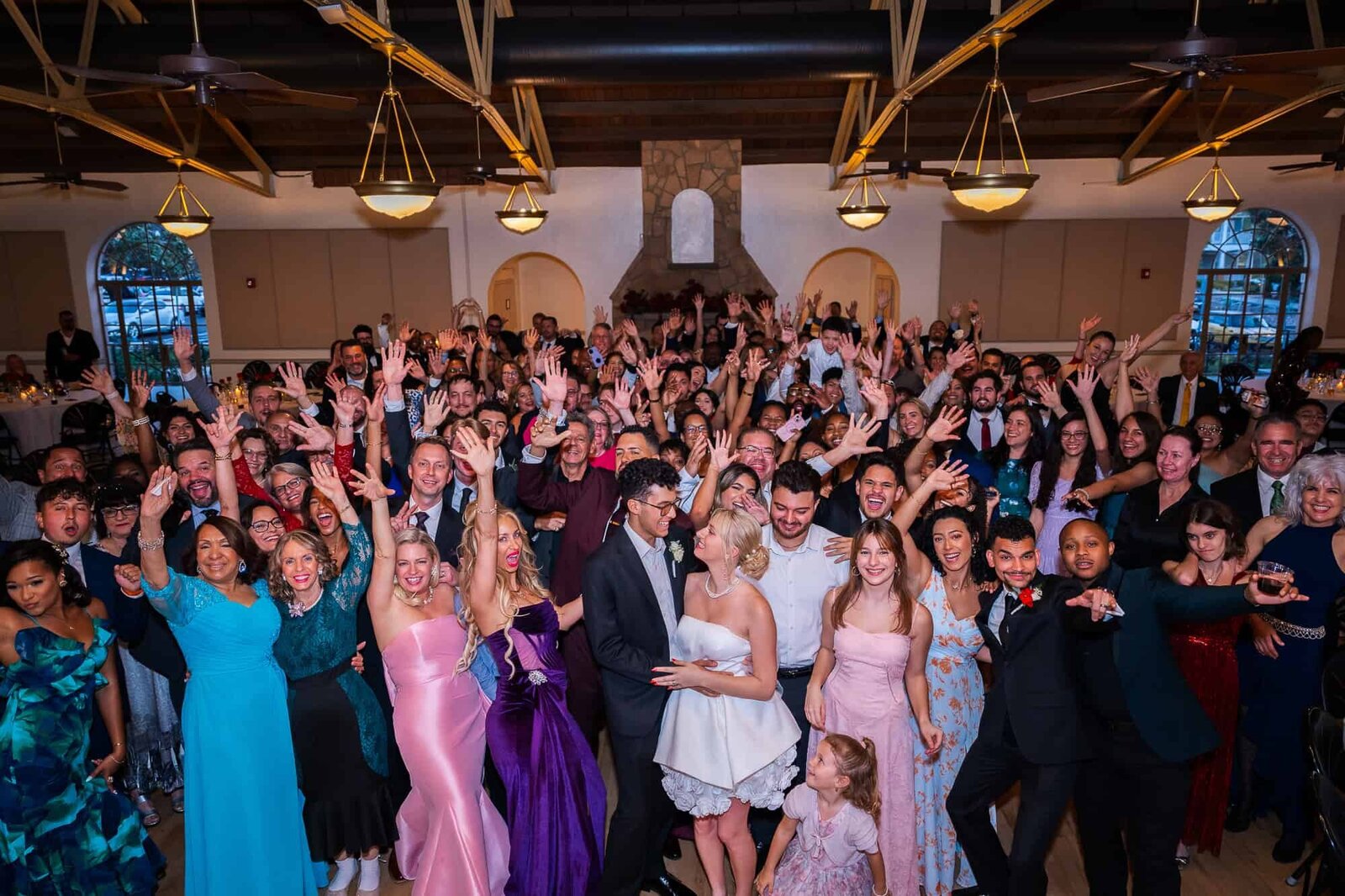 huge group photos of all guests attending wedding reception at Magnolia Building in Lakeland, Florida