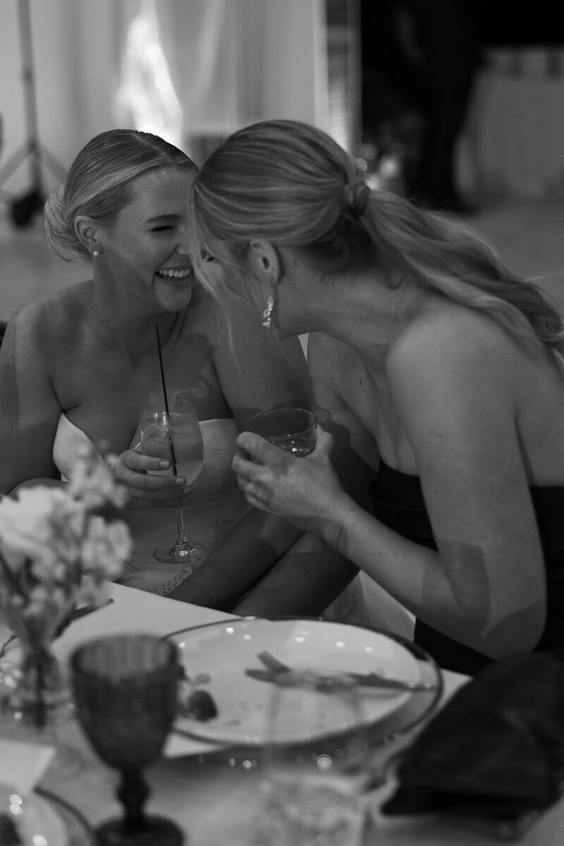 bride and bridesmaid laughing at wedding in Fort Myers Florida