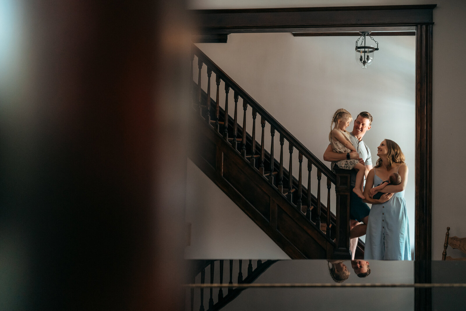 family standing near staircase