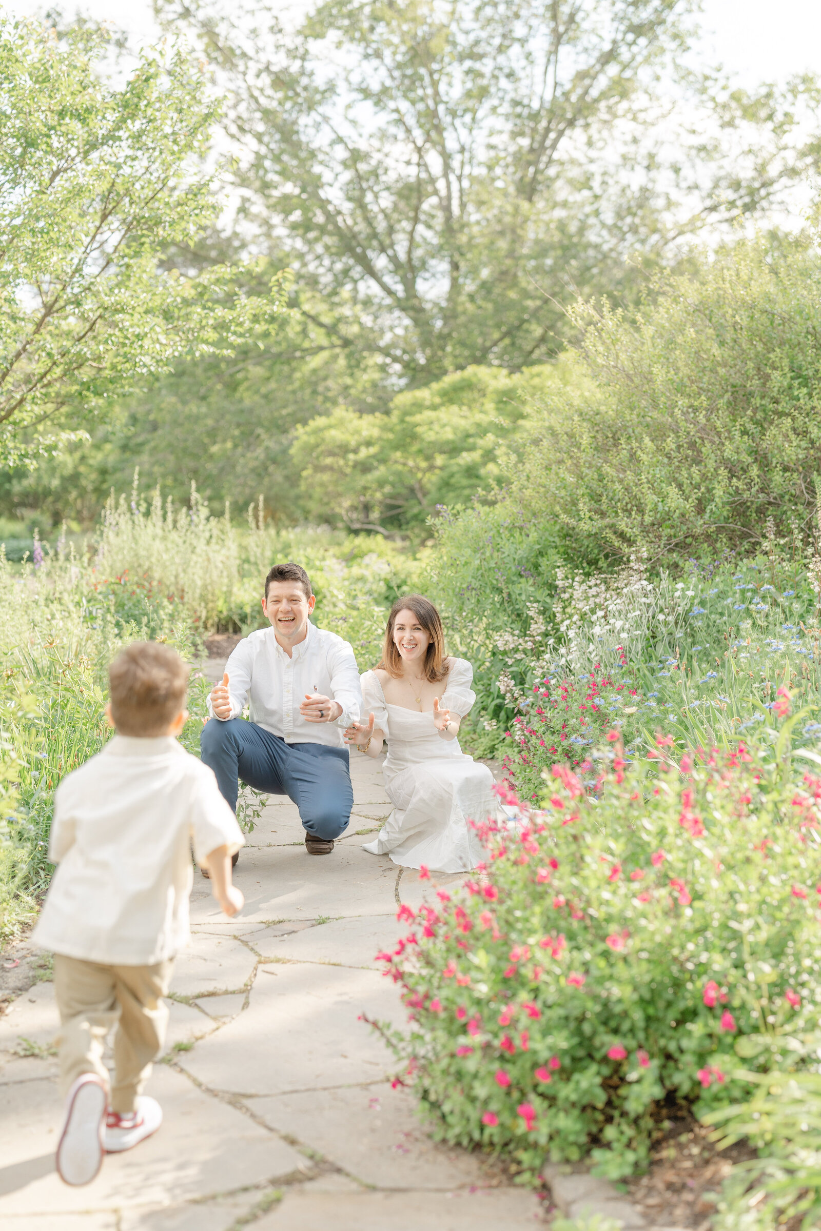 boy running towards parents during Chantilly, VA family session