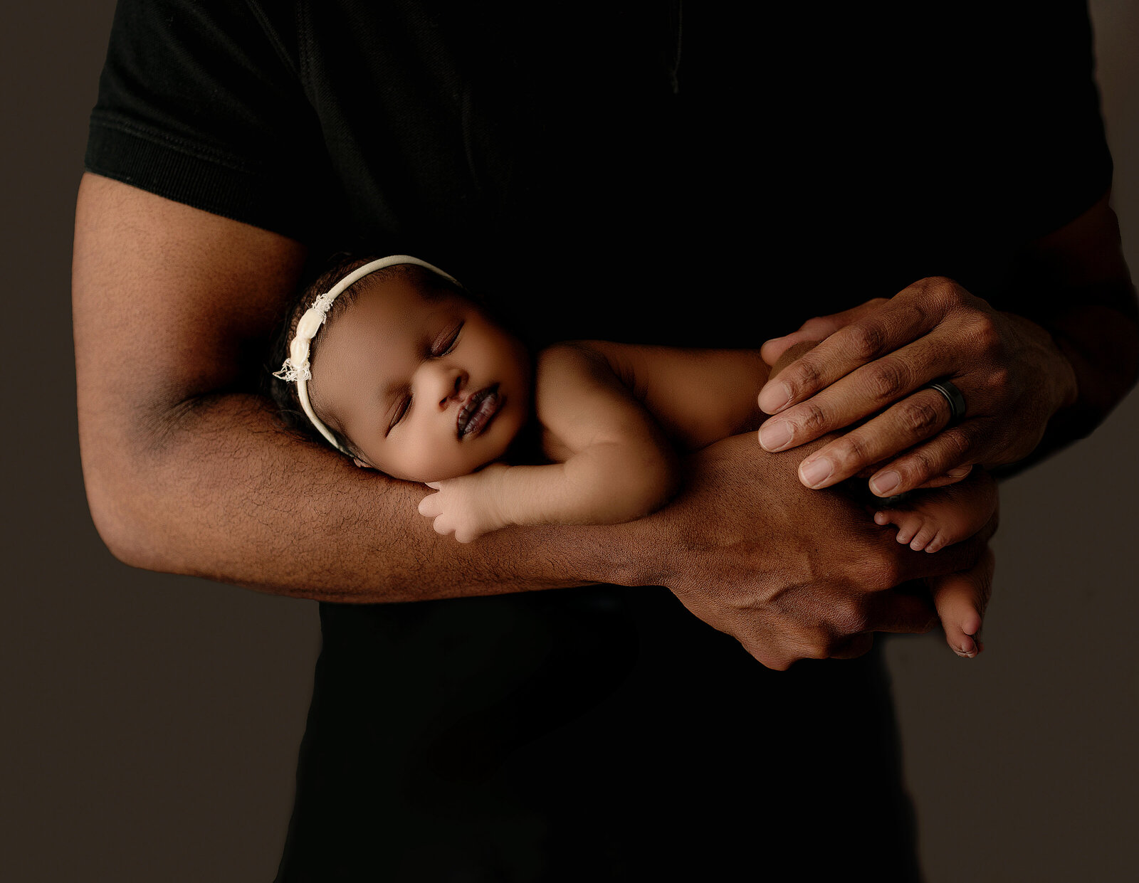 baby laying on white backdrop