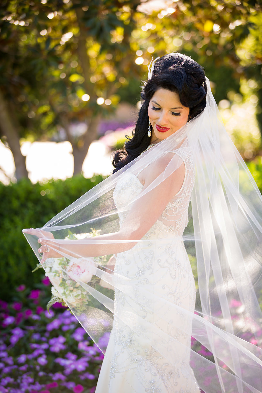 Bride playing with her veil