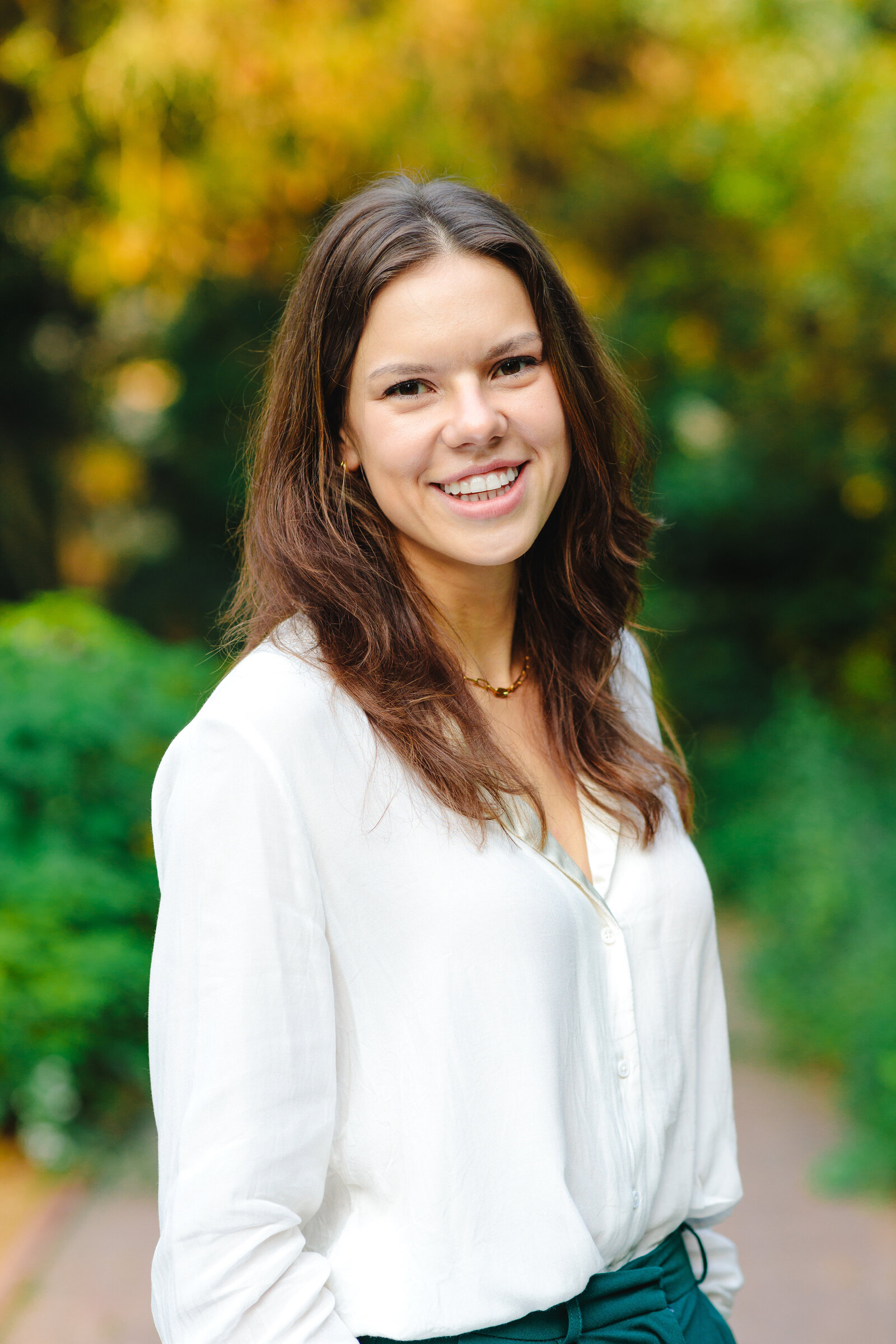 Woman smiling in white outfit for portrait photo
