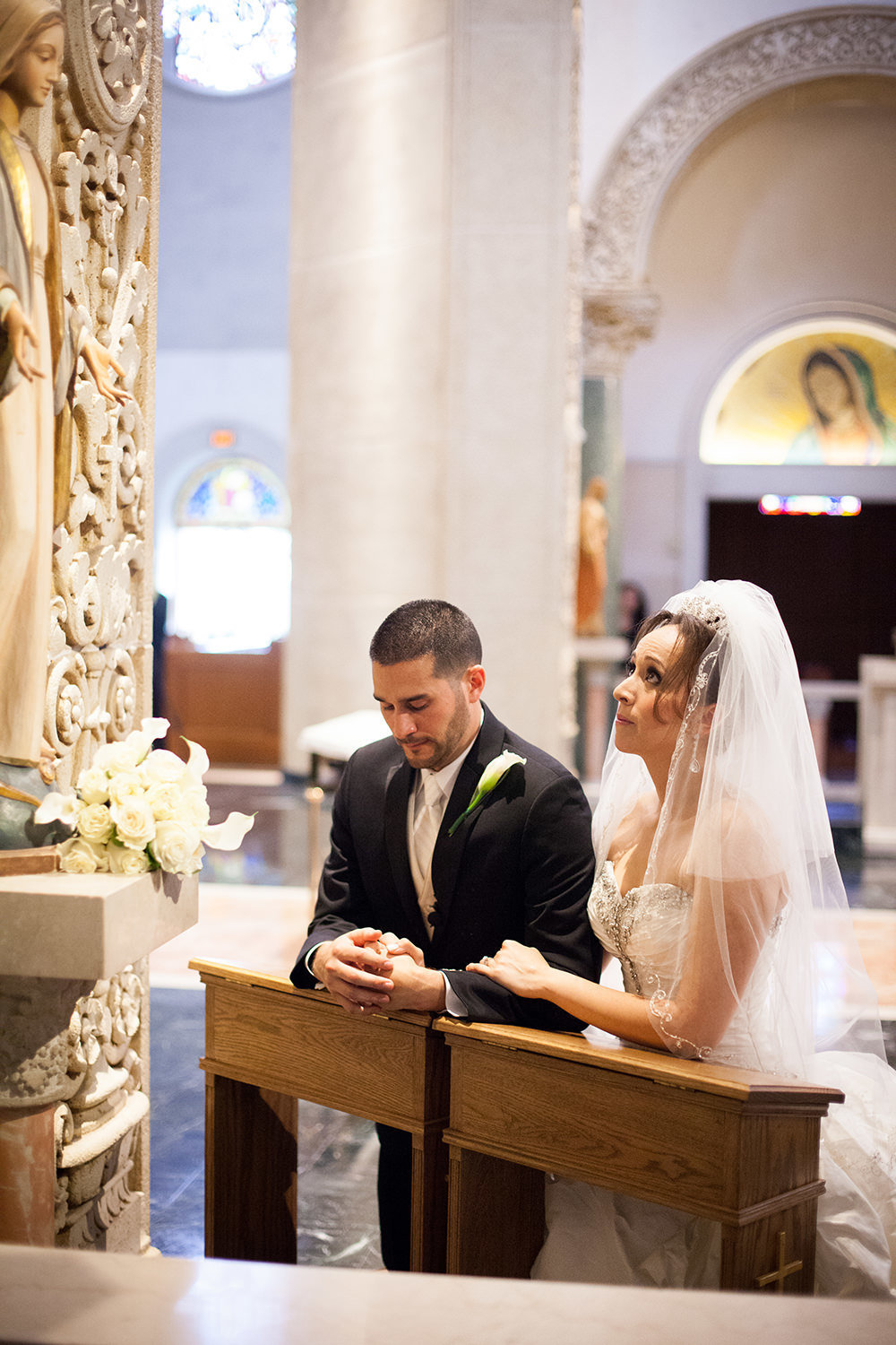 bride and groom saying their vows at the immaculata