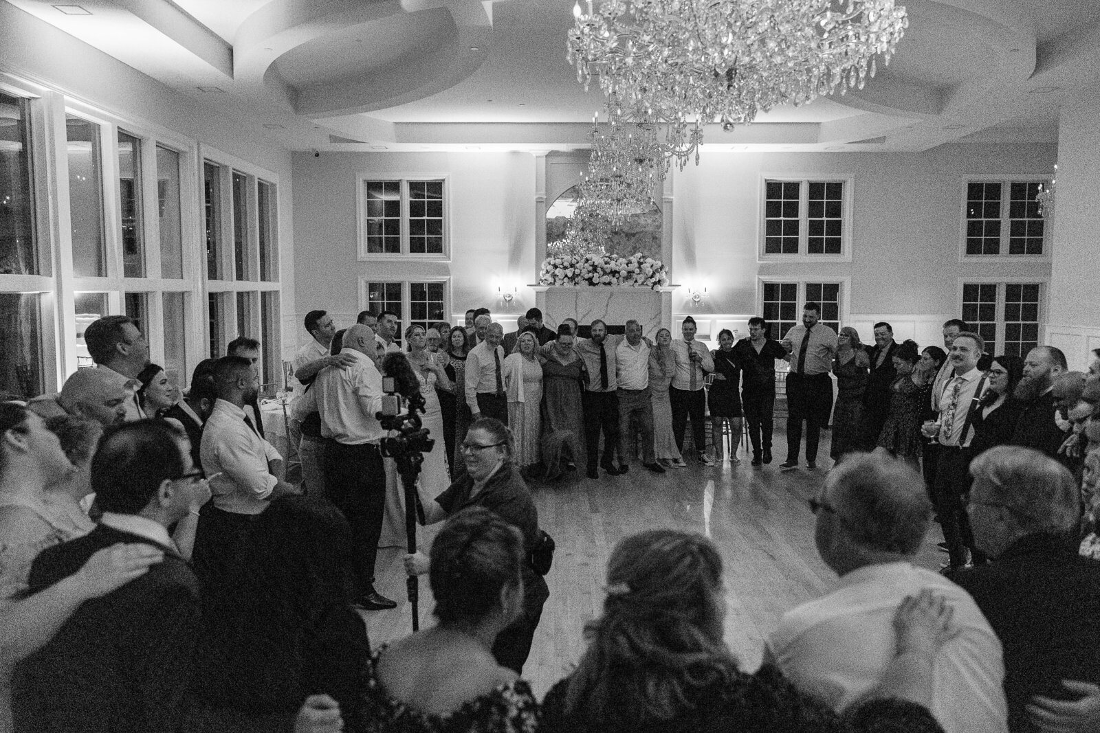 Candid black and white shots of guests dancing at SkyView Golf Club reception
