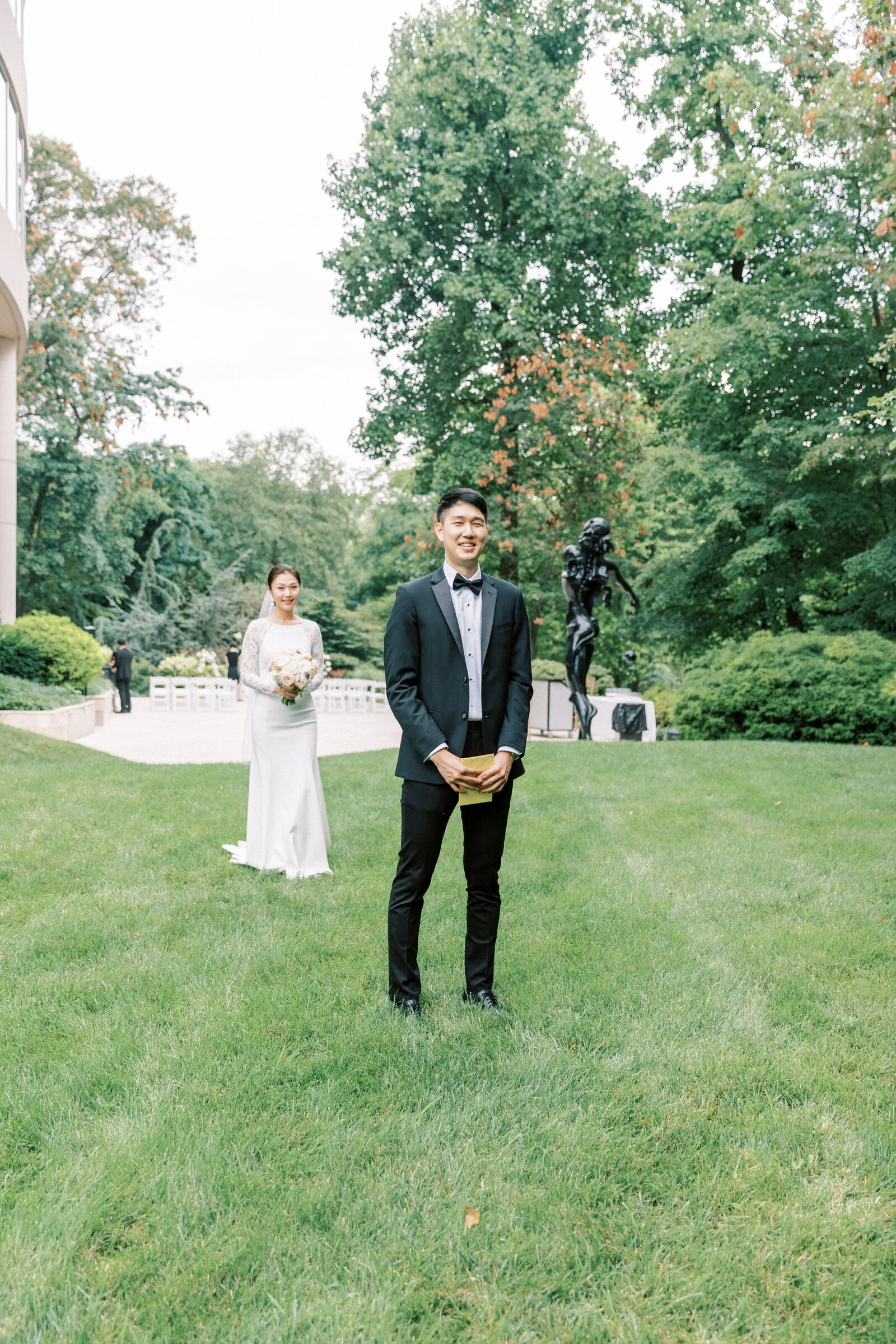 Bride walks up behind the groom for first look